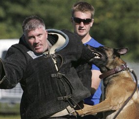 Richland County K-9 deputy Gerald Atkinson trains with Chico, a Belgian Malinois, during a training exercise Tuesday, Oct. 21, 2008, in Columbia, S.C. Looking on is instructor T.J. Westrik, of Holland's Royal Dutch Police. Some 40 police canine teams from around the U.S. participated in the week long training.