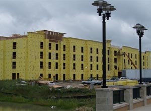 Photo Gary BowkerToday's lightweight wood frame structures include commercial buildings which can be massive in size, creating huge un-sprinklered void spaces with the entire structure being wrapped in foam insulation.