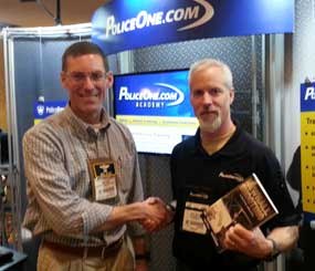 Mike Wood (left) pictured with Doug Wyllie at the PoliceOne booth at SHOT Show 2014.
