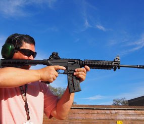 The Mossberg International 715T is essentially a Mossberg 702 Plinkster in a molded AR-15 (A2 style) shell.