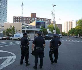 NYPD officers stand guard outside the Riverdale Jewish Center in the Bronx. Four men bent on carrying out a holy war against America were arrested after planting explosives near a synagogue and plotting to shoot down a military plane. (AP Photo)