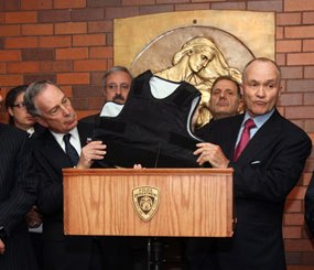 New York Mayor Michael Bloomberg and Police Commissioner Raymond Kelly show off the body armor that prevented Officer Robert Salerno from being fatally wounded.