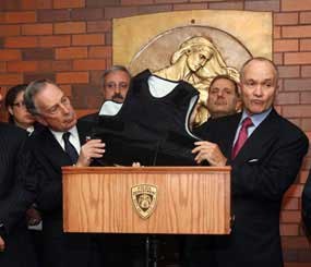Mayor Bloomberg shows off the Kevlar armor that protected Officer Robert Salerno from getting fatally wounded.