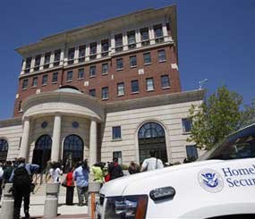 Members of the media gather outside a courthouse where the arraignment of four terror suspects occurred in on May 21, 2009. The men are accused of planting what they thought were explosives near two Bronx synagogues and are also accused of plotting to shoot down a military plane in Newburgh, New York.