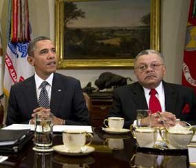In this file photo, President Barack Obama meets to discuss administration policies to reduce gun violence with representatives from Major Cities Chiefs Association and Major County Sheriffs Association at the White House in Washington. The National Rifle Association is using a Justice Department memo it obtained to argue in ads that the Obama administration believes its gun control plans won't work unless the government seizes firearms and requires national gun registration, ideas the White House has not proposed and does not support. At right is Charles H. Ramsey Police, Commissioner of the Philadelphia Police Department.