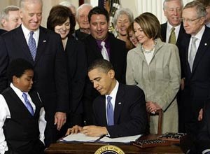 AP Photo/J. Scott ApplewhitePresident Barack Obama signs the health care bill in the East Room of the White House in Washington, DC, Tuesday.
