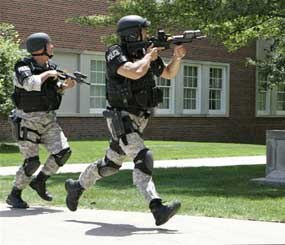 Police officers from the Omaha Emergency Response Unit conduct training for a possible