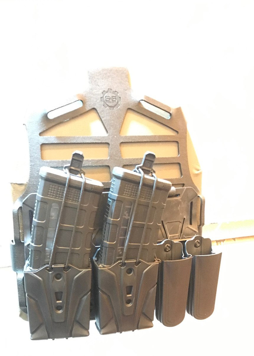S and S Precision takes a different approach to holster and plate carrier manufacture. The plate carrier starts with a precision-cut web called a PlateFrame that fits around the plate. A cummerbund, shoulder straps and tool-hanging devices are added. The holster mounts and Trifecta Connecta were designed to accommodate a number of different popular holsters, allowing police officers to adjust the height and use the same holster for duty as they would for critical response.