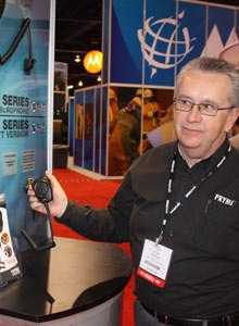 Photo Scott BrunerPryme president David George demonstrates Pryme's new WTX-4100 Tactical Microphone.