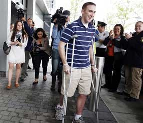 Officer Richard Donohue, who survived a showdown with the Boston Marathon bombing suspects, headed home Friday. (AP Image)