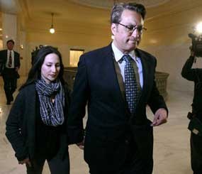 In this Jan. 13, 2012 file photo, San Francisco Sheriff Ross Mirkarimi, right, and his wife Eliana Lopez walk away after speaking to reporters at City Hall in San Francisco.