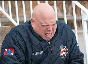 Photo J.C. Rice
Timothy Dluhos sobs after he was confronted by New York Post reporters.