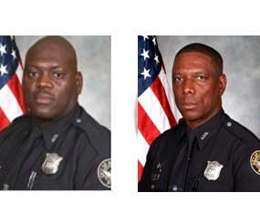 These photos provided by the Atlanta Police Department show Richard Halford and Shawn Smiley. The two officers identified Nov. 4 were killed in a helicopter crash the night before while searching for a missing child.