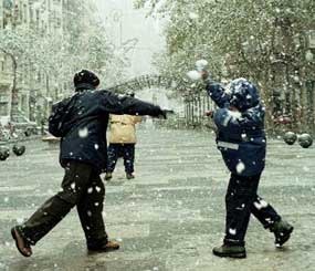 You come across a group of juveniles throwing snowballs at passing cars in the street. What do you do? (AP photo)