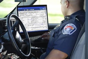 Jesse Cordova, a patrol officer for West Valley City Police Department in Utah, enters information into an accident form using Spillman’s field-based Accident Reporting Interface. (Photo courtesy of Spillman Technologies)