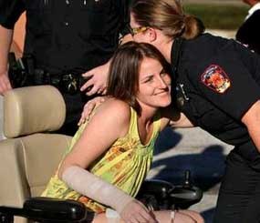 Auburndale Police Officer Stacy Booth used a red electronic wheelchair to get around the parking lot of the McDonald's at 420 Havendale Blvd. as she greeted those who came to support the fundraiser to help pay for her medical expenses.