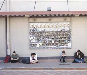 Texas A&M students wait for the campus to reopen while authorities investigate a bomb threat Friday, Oct. 19, 2012 in College Station, Texas.