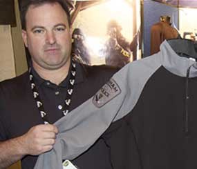 Glen Turpin of Tac Wear is also an officer in Toronto, Canada, and displays a garment that is essentially CoolMax under shirt attached to poly-cotton BDU sleeves, this one with his own actual agency patches on it.
