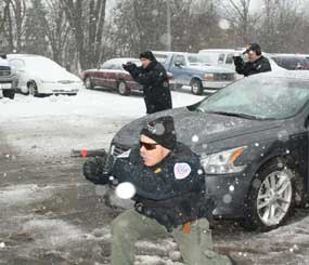 The weather is freezing, a mixture of snow and rain is falling, and sharp winds blow across the slush underfoot. As the felony traffic stop unfolds, the officers responding begin to have a complex problem on their hands.