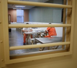 Detainees at the Otay Mesa Detention Center in south San Diego wait in one of the areas of the medical section in March 2017. (Nelvin C. Cepeda/San Diego Union-Tribune/TNS)