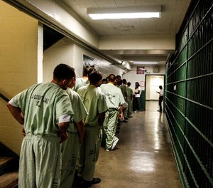 A line at the Men's Central Jail forms as inside the general area where inmates take breaks are waiting to be helped by the ACLU of Southern California, who are registering inmates that are eligible to vote. (Maria Alejandra Cardona\ Los Angeles Times/TNS)