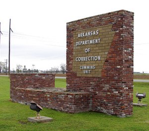 This March 25, 2017, photo shows a sign for the Department of Correction's Cummins Unit prison in Varner, Ark. Eight prisoners have been scheduled to die at the prison in April as Arkansas rushes to use an execution drug that expires at the end of the month.