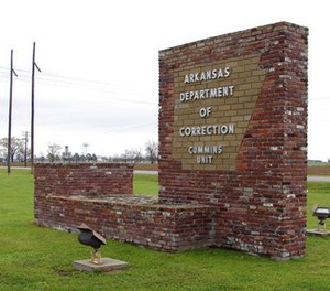 This March 25, 2017, photo shows a sign for the Department of Correction's Cummins Unit prison in Varner, Ark.