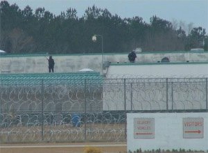Armed guards stand on the roof of the Lee Correctional Institution near Bishopville, S.C., on Feb. 26, 2015/ (Photo WLTX)