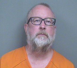 Scott Schlemmer, 60, is accused of assaulting two EMTs and a police officer after allegedly threatening to shoot people at a senior residential facility. (Photo/Mahoning County Sheriff's Office)