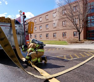 A firefighter disconnects LDH during a training exercise.