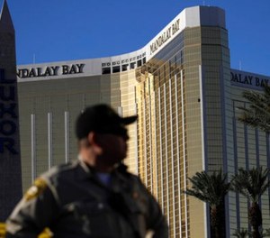 In this Oct. 3, 2017 file photo, a Las Vegas police officer stands by a blocked off area near the Mandalay Bay casino in Las Vegas.