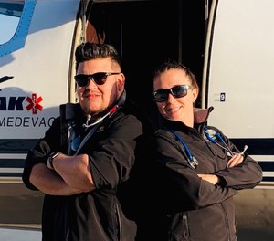 This undated photo shows Respiratory Therapist Roman Valles (left) with one of his colleagues at Peak Medevac. Valles' colleagues helped transport him home to Colorado after he contracted COVID-19 while working on an assignment in Texas.