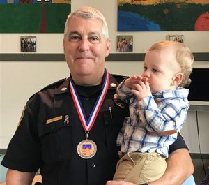 Lt. Alan Lessieurr with his grandson Asher.