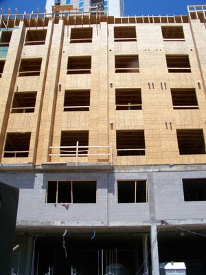 Construction materials and methods in mid-rise buildings can be any combination of hybrid material. Mid-rise buildings can fall in any category of fire resistance I-V, depending on what the city of builder wants.