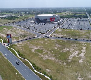 Cars line up for COVID-19 testing at Bert Ogden Arena in Edinburg, Texas on July 8, 2020. Federal, state and local officials in the Rio Grande Valley have established mass testing sites to tackle virus