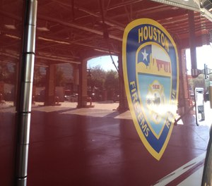 A Houston firefighter was shot in the back with a pellet gun while responding to a storage unit fire on Friday.
