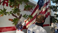 Photo of the Week: Fla. task force raises flag from floodwaters