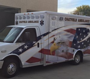 A woman is accused of kicking and spitting on a Chatfield Ambulance Service paramedic while being transported after a vehicle crash last week.