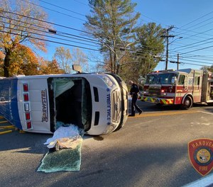 Two EMTs had to be freed from an ambulance by first responders after the rig was involved in a two-vehicle crash.