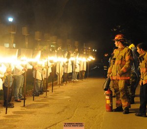 This photo shows traditional flambeauxs at the Mardi Gras parade in 2016. New Orleans Fire Department officials have announced that NOFD fire trucks will not be in this year's parade, as a labor battle between the city's fire union and city officials continues.