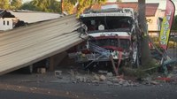 Video: Crash sends Phoenix fire engine into carport