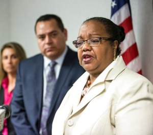 Wayne County Prosecutor Kim Worthy answers a question after announcing charges in several different cases involving police at the Frank Murphy Hall of Justice in Detroit, Wednesday, Dec. 20, 2017. (Junfu Han/Detroit Free Press via AP)