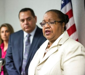 Wayne County Prosecutor Kim Worthy answers a question after announcing charges in several different cases involving police at the Frank Murphy Hall of Justice in Detroit, Wednesday, Dec. 20, 2017. (Junfu Han/Detroit Free Press via AP)