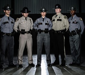 Kentucky State Police troopers stand at attention.