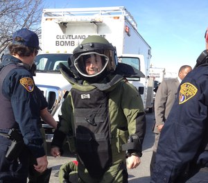 A member of the Cleveland Police bomb squad suits up on April 1, 2014.