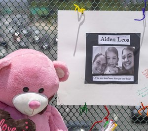 A stuffed bear and a poster memorialize a 6-year-old Orange County, California, boy who was shot and killed during a road rage attack in May. Police in some areas say they’ve seen road rage incidents spike during the COVID-19 pandemic.