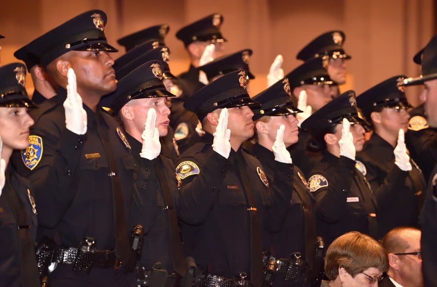 Golden West College Police Academy Class 153 graduation recruits take the Law Enforcement Code of Ethics oath at the conclusion of graduation ceremonies in March 2017.