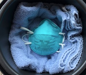 Researchers found that one 50-minute, 212 F cooking cycle in a dry electric multicooker decontaminates an N95 respirator without compromising the filtration or fit. (Photo/Chamteut Oh, University of Illinois, Urbana-Champaign)