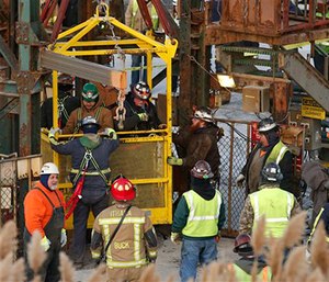 The fourth group of workers emerge from an elevator after they were stuck overnight in a shaft at the Cayuga Salt Mine in Lansing, N.Y.
