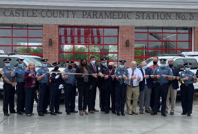 Paramedics from Station 5 join local dignitaries for the ribbon cutting ceremony.